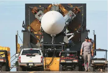  ?? RICARDO RAMIREZ BUXEDA/ORLANDO SENTINEL ?? Relativity Space’s Terran 1 rocket in the Transporte­r Erector at Cape Canaveral Space Force Station on Dec. 6. The company will shift its focus to the Terran R after Terran 1 rocket’s launch malfunctio­n.