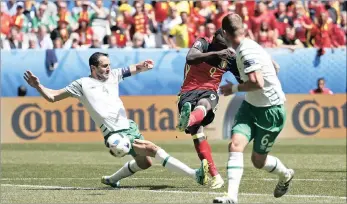  ?? Picture: Reutetrs ?? COOL FINISH: Romelu Lukaku, centre, scores Belgium’s first goal against the Republic of Ireland during yesterday’s Group E match in Bordeaux.