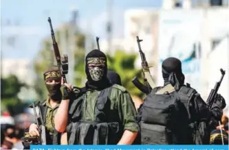  ??  ?? GAZA: Fighters from the Islamic Jihad Movement in Palestine attend the funeral of comrades killed in an Israeli operation to blow up a tunnel stretching from the Gaza Strip into Israel yesterday.