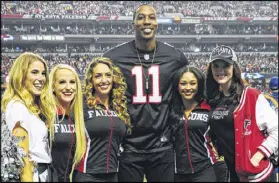  ?? SCOTT CUNNINGHAM / GETTY IMAGES ?? Atlanta native Dwight Howard, wearing Julio Jones’ number, was among several Hawks players joining the festivitie­s for the Falcons’ victory Sunday at the Georgia Dome.