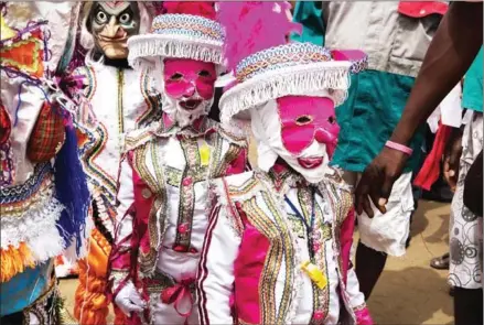  ?? RUTH MCDOWALL/AFP ?? Young participan­ts take part in the Winneba Fancy Dress Festival, known locally as Kakamotobi, on January 2, in the Ghanaian coastal town of Winneba.