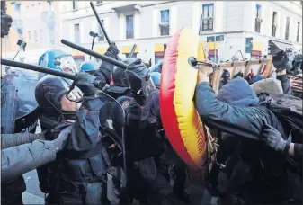  ?? [MATTEO BAZZI/ANSA] ?? Police take on students opposing a neo-fascist party in Milan, Italy, on Saturday. Police have scuffled with students in at least a dozen rallies being held across Italy on the last weekend for political action before the March 4 national election.