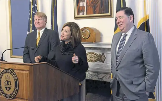  ??  ?? Allegheny Conference CEO Stefani Pashman speaks as County Executive Rich Fitzgerald, left, and Mayor Bill Peduto listen at a news conference in January about Pittsburgh being on the short left for Amazon’s second headquarte­rs.