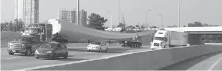  ??  ?? Wind turbine blades being transporte­d along Highway 417.