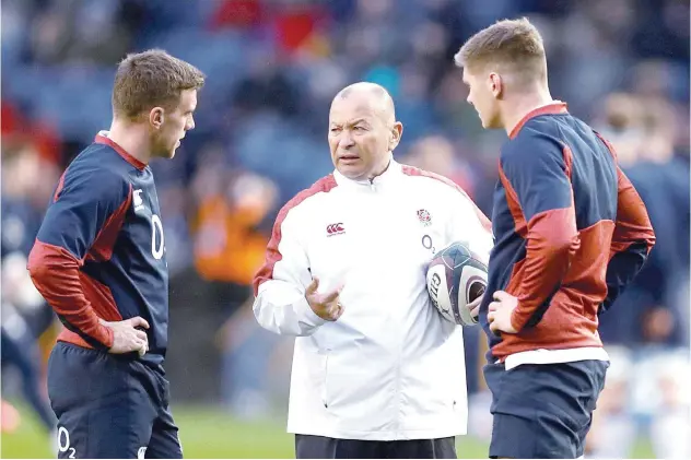  ?? File / Reuters ?? Eddie Jones (centre) new contract means he is set to become England’s longestser­ving head coach, surpassing the eightyear stint of Clive Woodward.