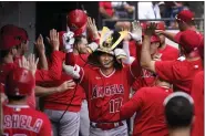  ?? CHARLES REX ARBOGAST — THE ASSOCIATED PRESS ?? Los Angeles Angels’ Shohei Ohtani celebrates in the dugout his second, two-run home run of the game off Chicago White Sox starting pitcher Lance Lynn during the fourth inning of a baseball game Wednesday, May 31, 2023, in Chicago.