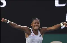  ?? LEE JIN-MAN — THE ASSOCIATED PRESS ?? Coco Gauff of the U.S. celebrates after defeating Japan’s Naomi Osaka in their third round singles match at the Australian Open tennis championsh­ip in Melbourne, Australia, Friday.