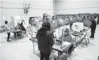  ?? Elizabeth Conley / Staff photograph­er ?? Voters cast their ballots last year at the Victory Houston polling station, one of Harris County’s 24-hour locations.