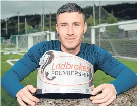  ??  ?? Michael O’Halloran with his player of the month award.