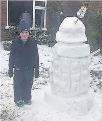  ??  ?? Alex Nicholson, seven, and sister Emily, 11, from Tytheringt­on, built a Dr Who-themed snowman