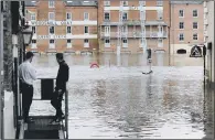  ??  ?? Flooding in York city centre as flood warnings were in place after the wet Easter weather.