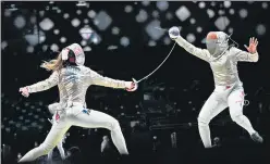  ?? AP ?? India’s CA Bhavani Devi (right) competing with Manon Brunet from France in the women’s individual round of 32 Sabre competitio­n at the Tokyo Olympics on Monday. India’s first ever fencer in the Olympics, Bhavani lasted two rounds against the world No 3 Brunet.