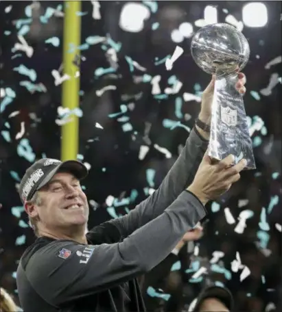  ?? THE ASSOCIATED PRESS ?? Eagles head coach Doug Pederson holds up the Vince Lombardi Trophy after defeating the New England Patriots in Super Bowl 52.