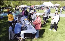  ?? BILL UHRICH — MEDIANEWS GROUP ?? Participan­ts line up to register during the 46th annual Walk for the Animals Saturday, May 6, in Jim Dietrich Park in Muhlenberg Township.