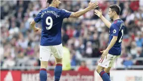  ?? AP ?? Manchester United’s Zlatan Ibrahimovi­c (left) celebrates scoring his side’s first goal of the game with teammate Ander Herrera during their English Premier League football match against Sunderland at the Stadium of Light, Sunderland, England, yesterday.
