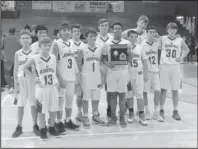  ?? Submitted photo ?? DISTRICT RUNNER-UP: Jessievill­e’s junior high boys’ basketball team presents its runner-up trophy on Saturday in Paris after a 52-35 loss to Fountain Lake in the 3A-4 district tournament final.