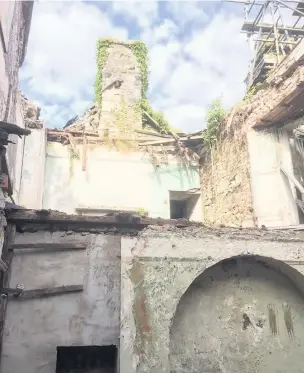  ??  ?? The abandoned ‘Island House’ in Laugharne has been crumbling down for the past 15 years but has now been saved after a community campaign.