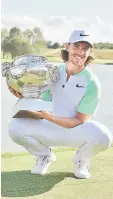  ??  ?? British player Tommy Fleetwood poses with the trophy after winning the HNA Open de France golf tournament at Le Golf National in Guyancourt, near Paris. — AFP photo