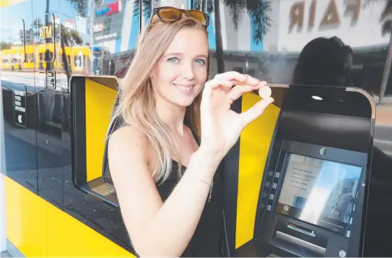  ??  ?? CommBank led the way and now other big banks are also ditching fees to use their ATMs, a move welcomed by Josca Van Kempen. Pictures: RICHARD GOSLING