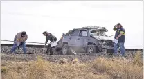  ?? SAMI EDGE/THE NEW MEXICAN ?? The Santa Fe County Sheriff’s Office says a woman lost control of her Jeep around noon Friday on Interstate 25 south of the N.M. 599 interchang­e and landed in the median along the tracks for the Rail Runner Express commuter train.