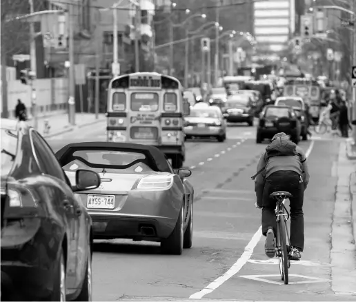  ?? TYLER ANDERSON / NATIONAL POST ?? The city said it will remove the bike lanes on Jarvis Street once a separated corridor on Sherbourne Street is installed.