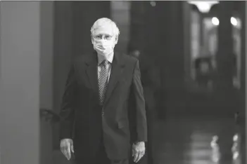  ?? ASSOCIATED PRESS ?? IN THIS OCT. 1 FILE PHOTO Senate Majority Leader Sen. Mitch McConnell of Kentucky. walks toward the Senate floor on Capitol Hill in Washington.