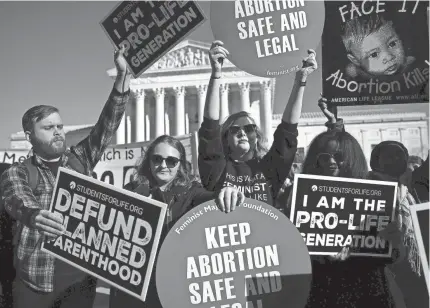  ?? GETTY IMAGES ?? Activists on both sides of the abortion demonstrat­e at the Supreme Court during the March for Life on Jan. 19.