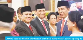  ??  ?? JAKARTA: Indonesian President Joko Widodo (R) and Defense Minister Prabowo Subianto (L) during the inaugurati­on ceremony at the State palace. — AFP