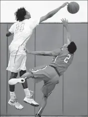  ?? Wally Skalij Los Angeles Times
By Eric Sondheimer ?? FAIRFAX’S Lindsey Drew blocks a shot by Orange Lutheran’s Joseph Riley during a playoff game.