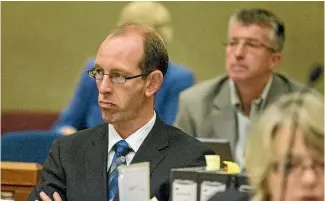  ??  ?? Journalist Martin van Beynen seated behind David Bain, as he was every day, to cover the 2009 trial.