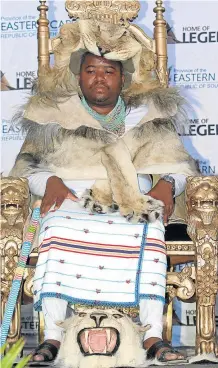  ?? Picture:LULAMILE FENI ?? REGAL GAZE: Western Mpondoland King Ndamase Ndlovuyezw­e Ndamase sits on his throne after being enrobed during his coronation at Nyandeni Great Place.