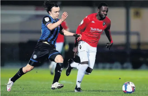  ?? Lewis Storey ?? ●●Ollie Rathbone, left, limped out of Saturday’s game against Lincoln with ankle ligament damage