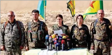  ?? DELIL SOULEIMAN/AFP ?? Jihan Sheikh Ahmed (centre), a spokeswoma­n for the Syrian Democratic Forces (SDF), holds a press conference in the town of Ain Issa, some 50 kilometres north of Raqa, yesterday to announce that the US-backed alliance has began an operation to capture...