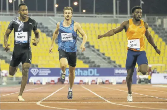  ?? (Photo: AFP) ?? Jamaica’s Julian Forte (left) crosses the finish line in second place in the men’s 200m, beaten by Ivory Coast’s Arthur Cisse’s (right), while France’s Christophe Lemaitre (centre) was third during the IAAF Diamond League competitio­n yesterday at the Suheim Bin Hamad Stadium in the Qatari capital Doha.