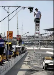  ?? DARRON CUMMINGS — THE ASSOCIATED PRESS ?? A technician checks on one the dozens of television cameras used for during the broadcast of the Indianapol­is 500.