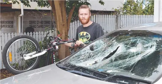  ?? TERRIFYING: Tarant Metherall with the bicycle that was thrown through his windscreen. Picture: WESLEY MONTS ??