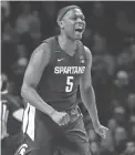  ??  ?? Michigan State guard Cassius Winston reacts after hitting a 3-pointer against Minnesota on Sunday.