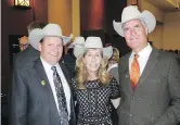  ??  ?? Pictured with reason to smile at the fundraiser in support of the Stampede’s Youth Programs are Calgary Stampede vice-chairman Dana Peers, Gretchen Thompson and her husband Bob Thompson, Stampede Foundation chairman.