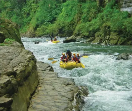  ??  ?? Whitewater rafting along the upper Navua river with Rivers Fiji.