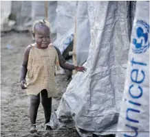  ?? Ben Curtis/The Associated Press ?? A displaced girl cries after the relative she was with disappears into a row of latrines at a UN camp in Juba, South Sudan, on Sunday.