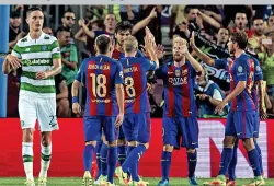  ??  ?? Misery: Mikael Lustig and Co were thumped 7-0 in the Nou Camp