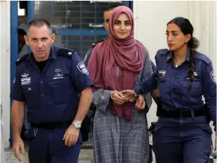  ?? (Nir Elias/Reuters) ?? TURKISH CITIZEN Ebru Ozkan, who was arrested in Israel last month, is brought to a military court yesterday.