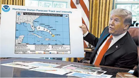  ?? EVAN VUCCI/AP ?? Insisting Alabama was in danger from Hurricane Dorian in 2019, President Trump displayed a map altered by a marker.