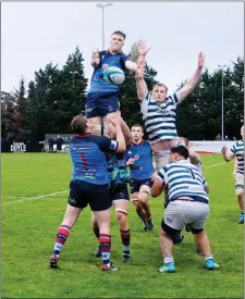  ??  ?? Greystones’ Dan Mannion competes against Belfast’s Jaz Andress in the line out in Dr Hickey Park.