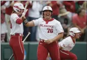  ?? BRYAN TERRY — THE OKLAHOMAN VIA AP ?? Oklahoma's Jocelyn Alo (78) celebrates with Jana Johns (20) after scoring a run against Texas A&M in the first inning in the NCAA Norman Regional in Norman, Okla., last week.