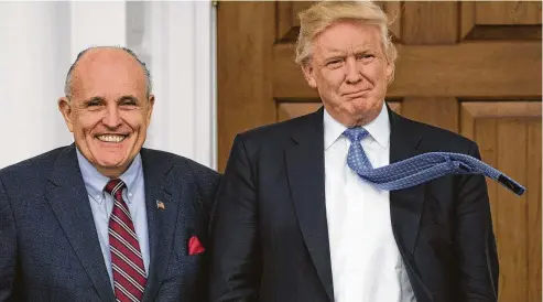  ?? DON EMMERT / AFP/Getty Images ?? Rudy Giuliani dropped a bombshell when he said Trump paid back hush-money given to porn star Stormy Daniels in October 2016 on his behalf.