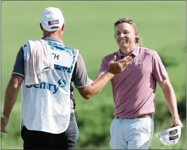  ?? GREGORY SHAMUS — GETTY IMAGES ?? Cameron Smith, right, celebrates with his caddie after shooting a PGA-record 34-under 258to win the Sentry Tournament of Champions at Kapalua Golf Club in Lahaina, Hawaii.