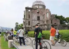  ?? KYODO NEWS/THE ASSOCIATED PRESS ?? Players descended on the Hiroshima Peace Memorial Park in Japan, prompting officials to ask that the memorial be removed as a Pokestop.