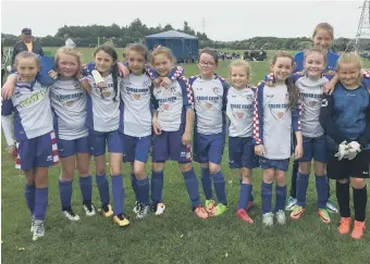  ??  ?? Boldon Girls Under 10s after winning a football tournament at Flamingola­nd.