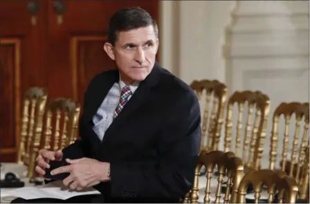  ?? CAROLYN KASTER — THE ASSOCIATED PRESS FILE ?? Then-National Security Adviser Michael Flynn sits in the East Room of the White House in Washington. Documents released by lawmakers show Flynn, now former national security adviser, was warned when he retired from the military in 2014 not to take...